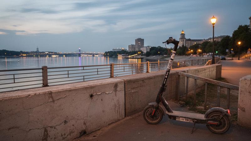Kyiv riverside path along the Dnipro with a scooter on the embankment